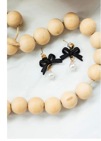 Black bow with pearl earrings